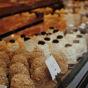 A tempting display of assorted pastries in a bakery, showcasing various textures and colors.